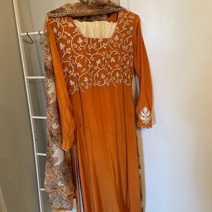Orange three piece georgette Indian outfit.